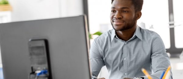 Man with computer working at a desk